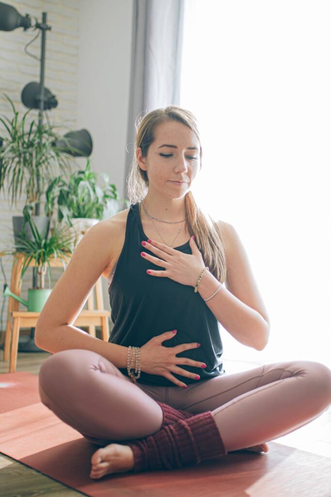 woman learning how to meditate and breathe properly