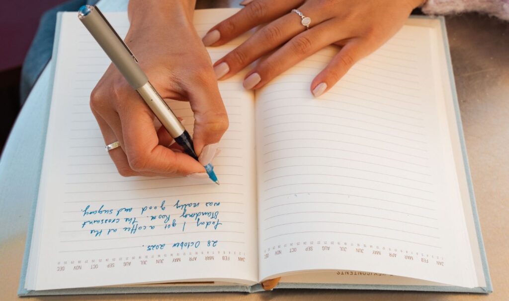 woman wants to start journaling and using her notebook to write in it.