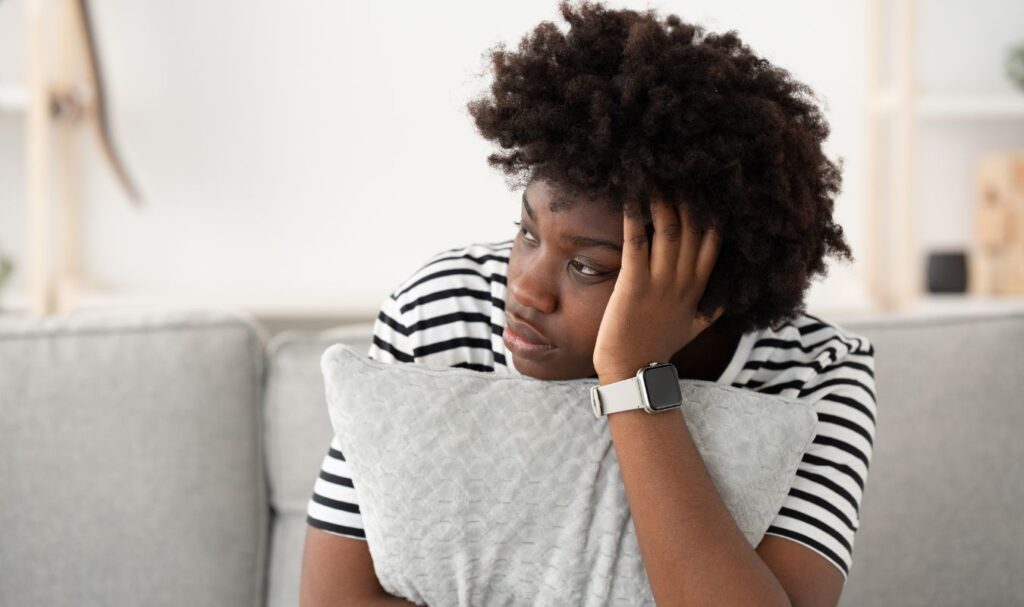 An image showing overthinking woman who needs one of the powerful mindfulness activities from this list.