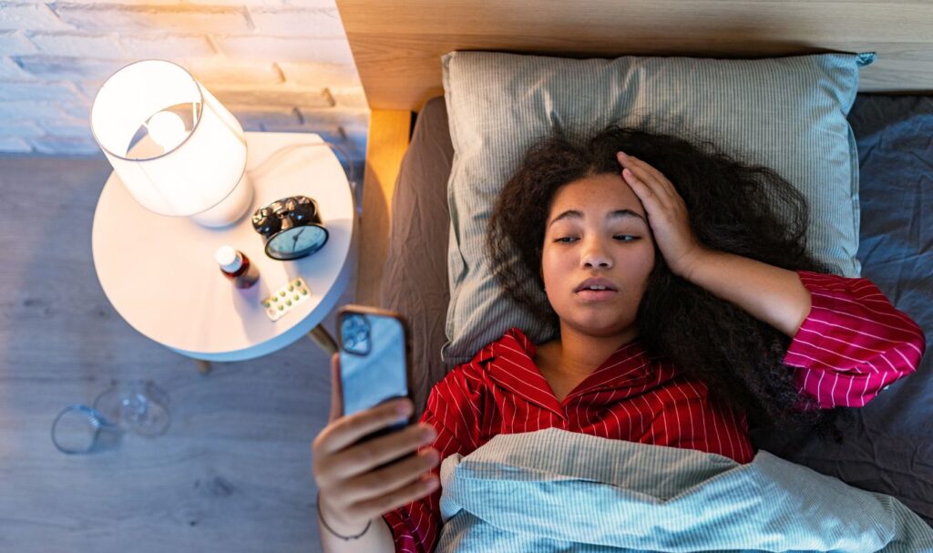 woman can't sleep, she needs one of the mindfulness activities for when a person struggles with falling asleep.