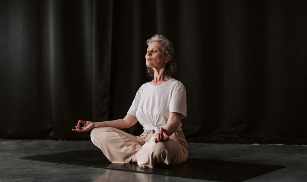 woman practicing meditation as a spiritual mindfulness activity