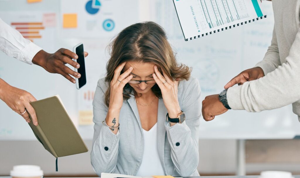 woman in an office setting, having burnout problems, and needing to learn how to use Mindfulness for Burnout
