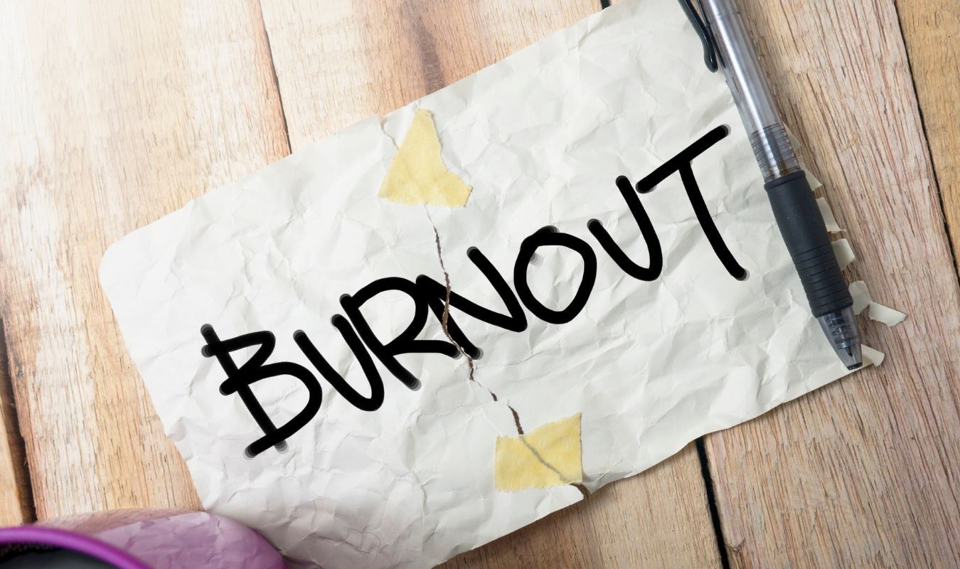 an image showing a piece of paper with the word 'burnout' written on it