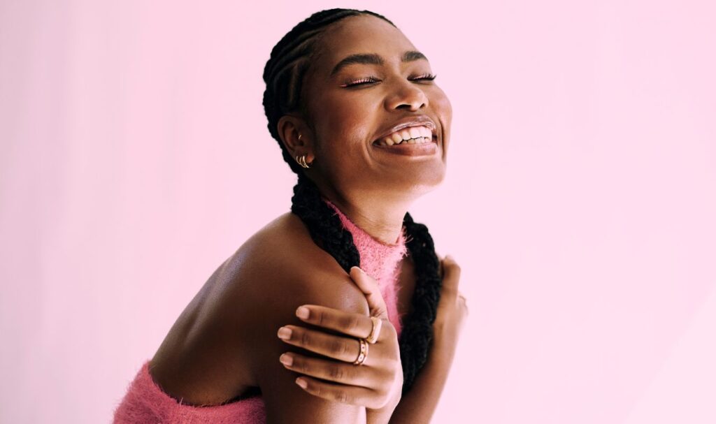 woman hugging herself practicing mindfulness for self-compassion