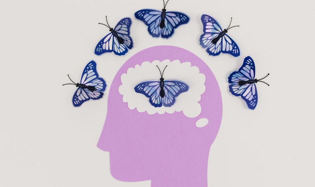 Creative illustration of the subconscious mind and manifestation with butterflies symbolizing transformation and positive thinking