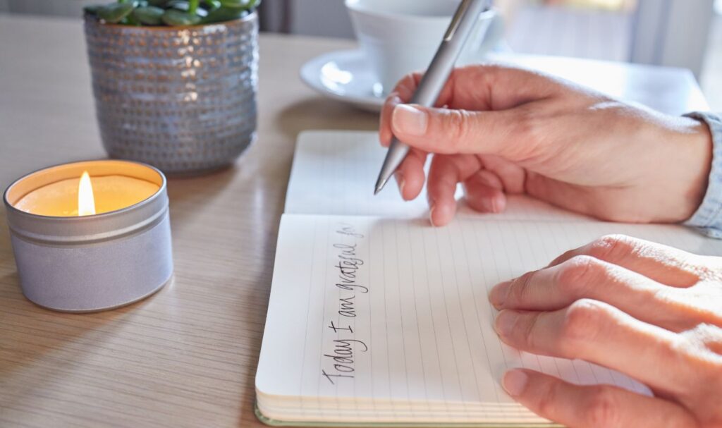 woman scripting using the 369 manifestation method
