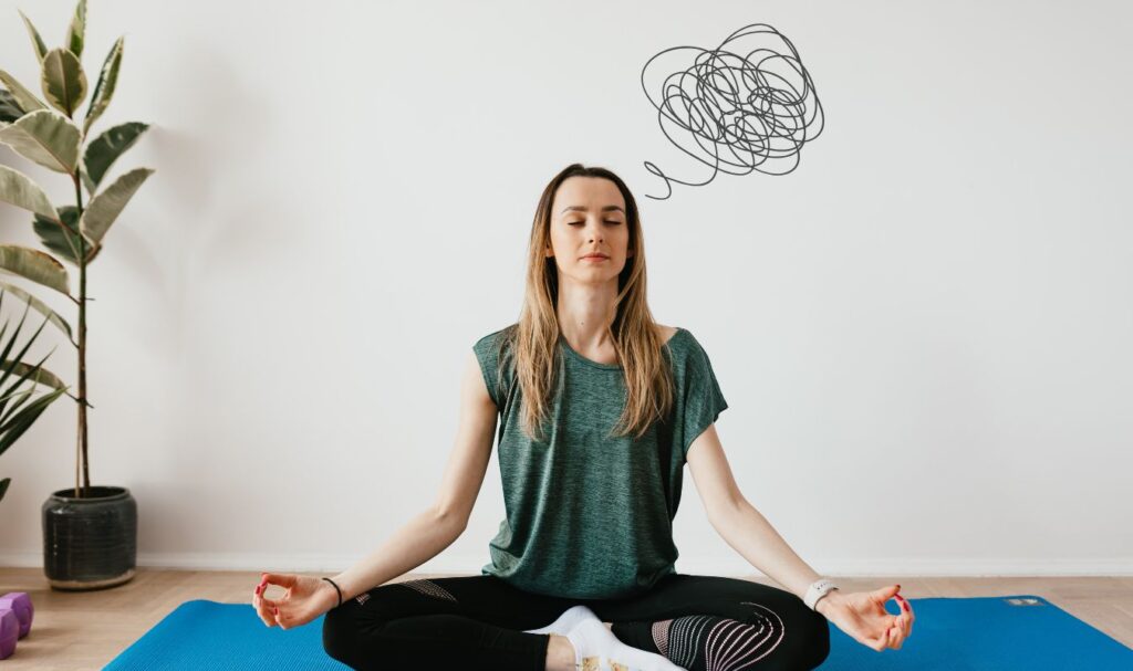 woman sitting in meditation, but due to the adhd she's not able to concentrate on her meditation